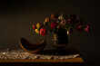© Alison Winterroth/Stocksy - Still life flower arrangement at sunset