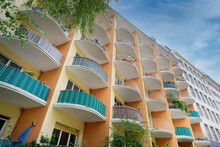 Many Semicircular Balconies On A Colorful Residential Building From The Middle Of The 20th Century In Cologne