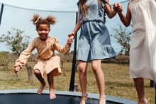 Girls Playing On A Trampoline
