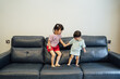 © ZQZ Studio/Stocksy - Cute little boy and girl playing at home