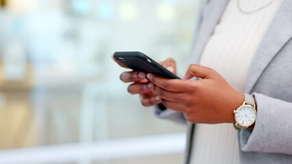 Wall Mural - Trendy businesswoman sending a message on her phone. Closeup of corporate worker staying connected after work by typing a text on convenient instant messaging communication app or checking emails