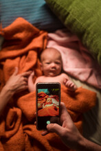 Taking A Picture Of Newborn With Phone