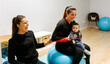 © Marco Govel/Stocksy - Mother and baby attending a postpartum recovery class