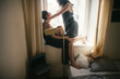© Yura Shevchenko/Stocksy - story of a real day of a couple two young women living together