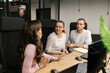 © STUDIO TAURUS/Stocksy - Co-workers Discussing Their Project