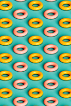 Vertical Pattern Of Yellow And Pink Inflatable Rings
