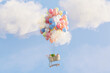 © Pixel Stories/Stocksy - Inflation and rising food prices concept. Cart  lifted by balloons.