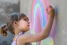 Cute Girl Drawing On The Wall