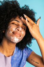 Hispanic Woman Cleansing Face With Handmade Soap