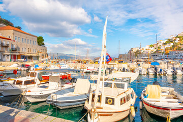 Wall Mural - The colorful harbor full with boats at the port and village of Hydra, Greece, one of the Saronic islands in the Saronic gulf off of mainland Greece.	