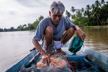 A Fisherman Checks Nets