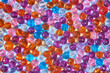 © Yaroslav Danylchenko/Stocksy - Seamless pattern of colorful beads