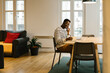 © STUDIO TAURUS/Stocksy - Smiling man at work having a phone call