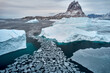 © Adam Sébire/Stocksy - Greenland aerial stock shot: sea ice fragments, Arctic global warming