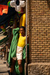 © Alba Vitta/Stocksy - Fancy queer black man posing  by downtown
