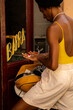 © Alba Vitta/Stocksy - Black queer stylish man outside bar