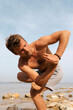 © Lucas Ottone/Stocksy - Man doing yoga outdoors