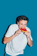 © Studio Firma/Stocksy - Man Eating Pizza