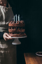 Chocolate Layered Birthday Cake With Blown Candles 