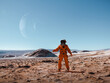 © Marcos Osorio/Stocksy - Astronaut exploring an unknown planet
