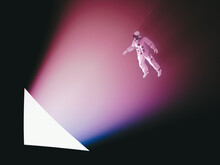 Astronaut Approaching A Triangle Of Light