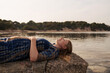 © Lucas Ottone/Stocksy - Pregnant woman relaxing