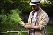 © Michela Ravasio/Stocksy - Man holding a fennel