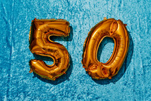 Golden Number-shaped Balloons Forming The Number 50