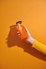 Be Bright And Healthy. Woman Hand With Detox Orange Juice