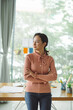 © Marc Tran/Stocksy - Pretty successful business lady with tablet computer standing