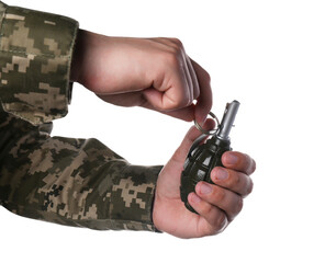 Soldier pulling safety pin out of hand grenade on white background, closeup