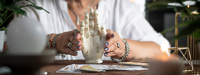 Wall Mural - Tarot cards on the table. Concept of psychic advisor or ways of divination.