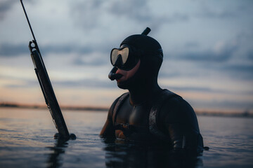 Wall Mural - Man spearfishing with a speargun