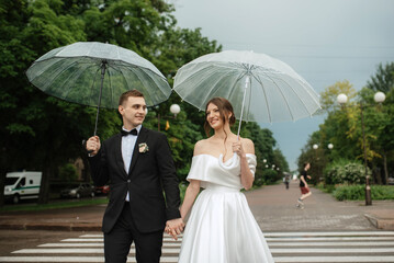 Wall Mural - young couple bride and groom in a white short dress