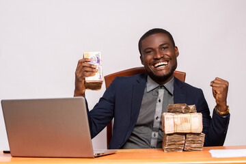 Wall Mural - african businessman with lots of money rejoices