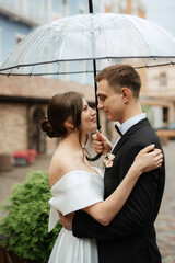 Wall Mural - young couple bride and groom in a white short dress