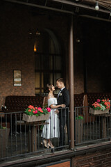 Wall Mural - young couple bride and groom in a white short dress