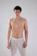 © Allen Penton - Cute young man with his shirt off and looking serious