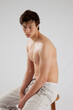 © Allen Penton - Cute young man with his shirt off and looking serious