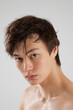 © Allen Penton - Cute young man with his shirt off and looking serious