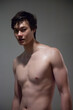 © Allen Penton - Cute young man with his shirt off and looking serious
