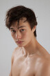 © Allen Penton - Cute young man with his shirt off and looking serious