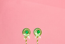 Snail At The Bottom Pink Background Of Two Paper Lollipops, Creative Minimal Concept, Art Design
