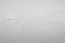 The Background Is In The Form Of A Section Of White Wall In A Village House. Plastered Wall And Whitewashed With Chalk. Old Cracked Plaster On The Wall.