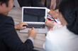 © sticker2you - Concentrated multiethnic coworker busy using laptop brainstorm sharing thoughts at office meeting