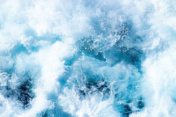 Top view of blue ocean waves splashing and foaming