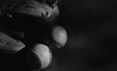 Canvas Print - Old sports background with dark baseball glove and balls, copy space on background.