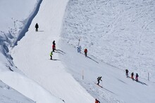 Group Of Skiers On The Mountain Slope