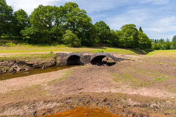 Wall Mural - A normally submerged old bridge at a near empty reservoir during a heatwave