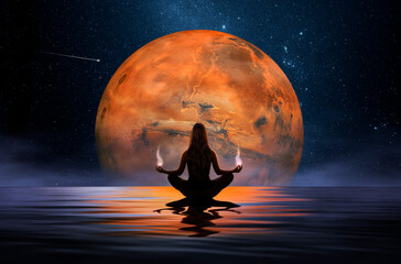 Wall Mural - woman meditating in front of the mars planet